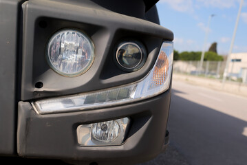 Modern semi-truck headlamp with fog light and led turn signal. © Валерий Коровка
