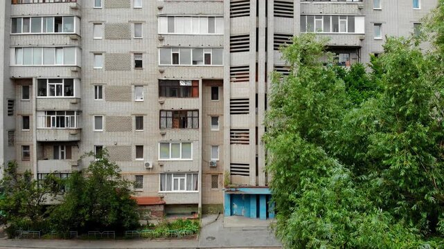 Wide aerial view of a residential district in Sumy, Ukraine with Soviet-era apartment buildings forming a dense urban neighborhood. Typical Eastern European living area and urban planning. 