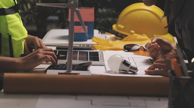 Construction engineers discussing project in office