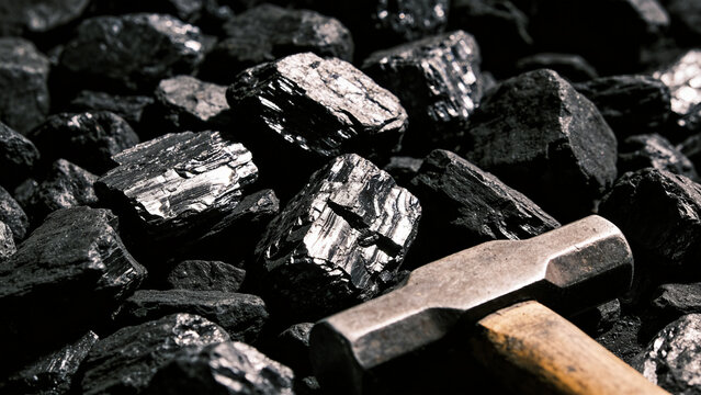 Hammer on pile of coal mining.