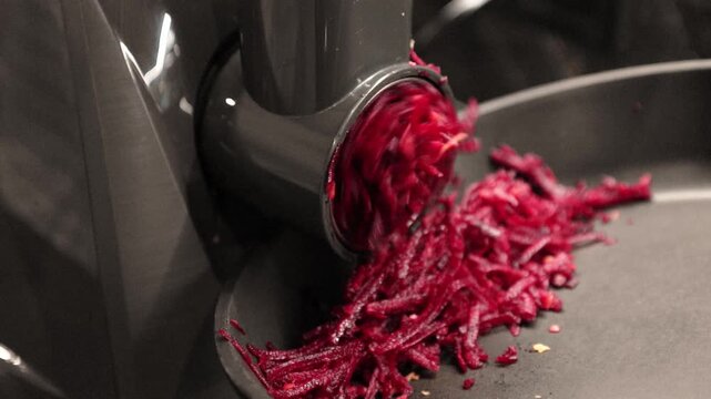 preparing beetroot salad with a meat grinder