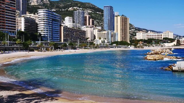 19.03.2026, Monaco. Beach Plage du Larvotto and skycrapers in the city
