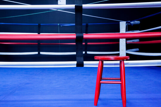 Empty Boxing Ring with Red Stool Concept of Preparation Before Fight