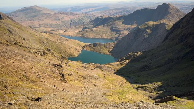 Hikers Ascending the Pyg Track to Mount Snowdon with Glaslyn and Llyn Llydaw Lake in Background, Eryri Snowdonia National Park, Gwynedd, North Wales, UK