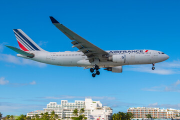 Fototapeta premium Air France Airbus 330-200 F-GZCG flying over Maho Beach before landing on Princess Juliana International Airport SXM on Sint Maarten, Dutch Caribbean. 