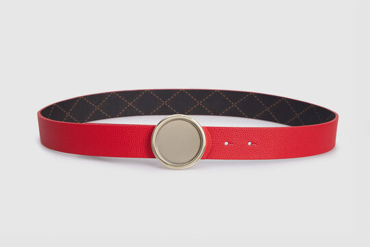 Red leather belt strap with big round metal golden decorative buckle isolated on white background, female women's waistband girdle cummerbund, flat lay, mock up, tamplate