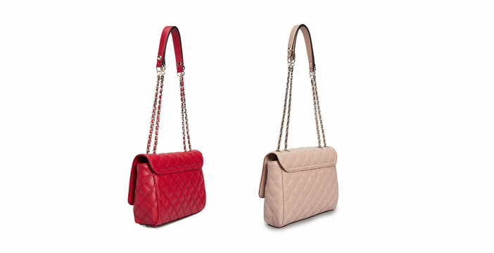 Set of two leather red beige Leather shoulder bags, handbags, cross body bags with metal chain strap handles Hanging Isolated on White Background. Side view