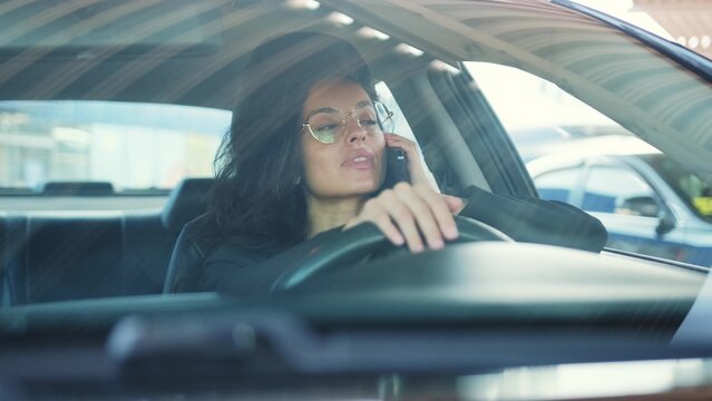 Lady driving and working online from auto