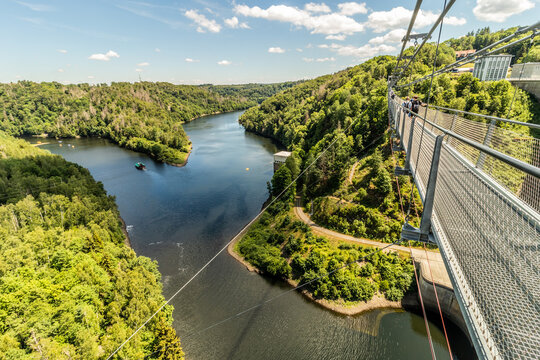 BODE, GERMANY - JUNE 28, 2022: Tourists at suspension bridge Titan RT above Wendefurth reservoir, Saxony-Anhalt state, Germany