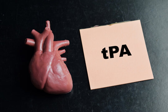 Concept of tPA - tissue plasminogen activator write on sticky notes isolated on Wooden Table.