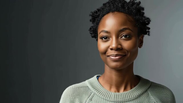 Woman portrait smiling short curly hair confident joyful young woman in green knit sweater portrait