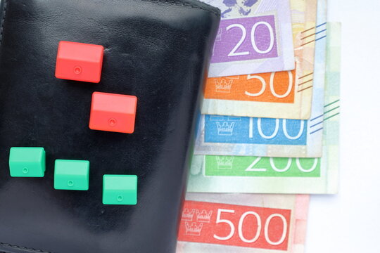 Money concept with black wallet. Swedish bank notes with small houses.