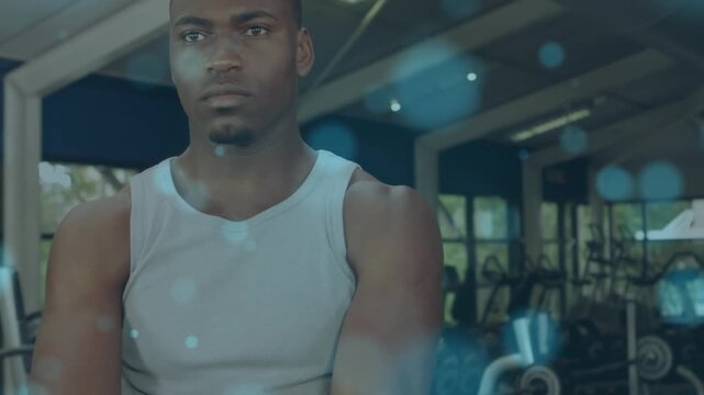A man is exercising with a kettlebell at the gym