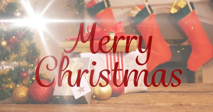 Animation of merry christmas text banner and golden stars against christmas gifts and decorations
