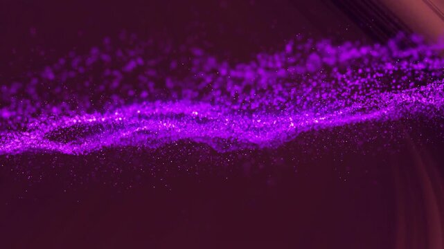 Animated illustration of purple particle wave sweeping across dark background, dust motes drifting