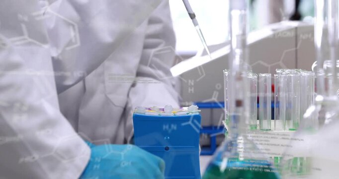 female researcher dispensing liquid into tube rack at lab bench, with chemical structures floating