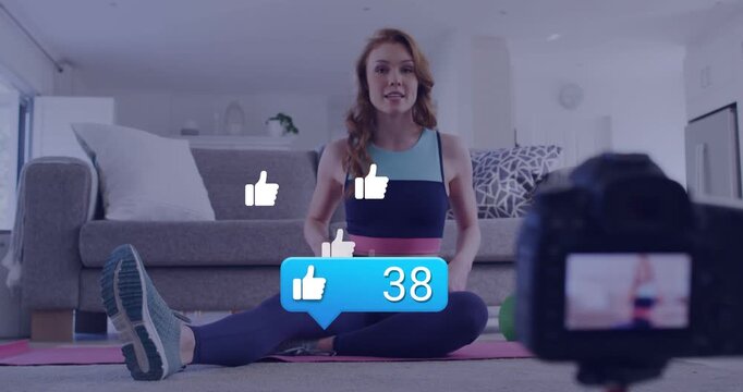 Fitness coach sitting on mat speaking to camera, causing like-count rising to 95, likes multiplying