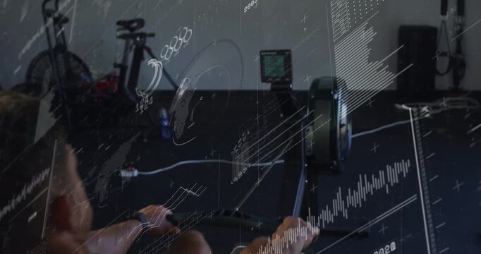 Man rowing, pulling handle to start, charts and waveforms overlaying monitor and back for fitness