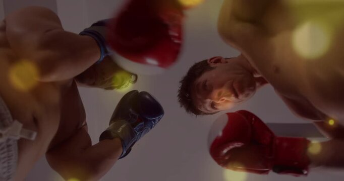 Low camera starting, two boxers checking range, adjusting guard for sparring, bokeh over faces