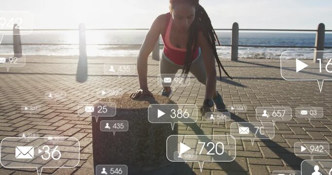 Woman starting from plank on bollard doing pushups for fitness with socials floating and counting