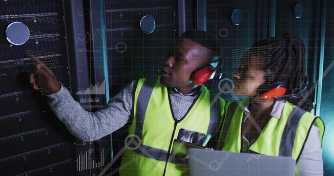 Pointing two techs checking rack in data center with laptop safety vests red earmuffs data overlays