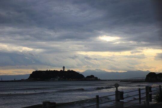 Enoshima Island at sunset, beachside, Japan.