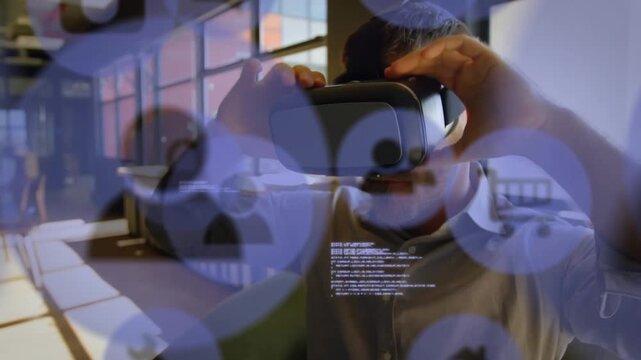 Animation of profile icons, programming language over caucasian man using vr headset in office