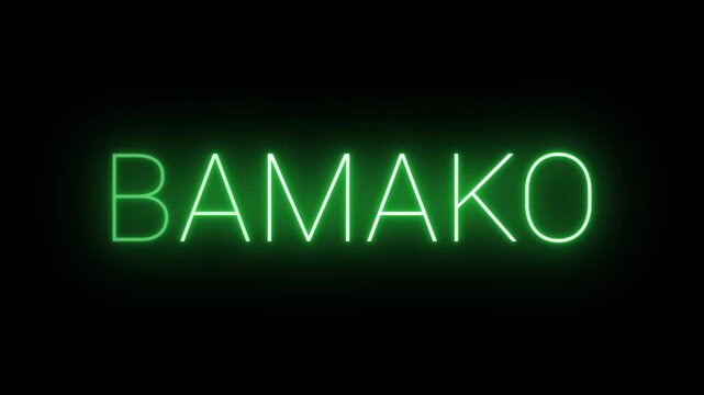 Flickering neon green glowing bamako sign animated on black background.