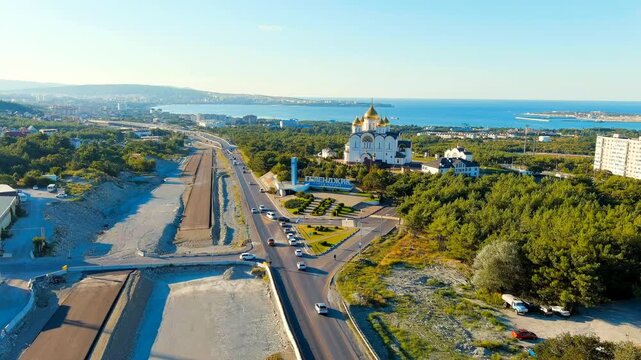Gelendzhik, Russia. Cathedral of St. Andrew the First-Called. The text along the M4-Don Highway is translated: Glory to Russia, Kuban-Pearl of Russia. Gelenzhik-City Resort. Drone footage