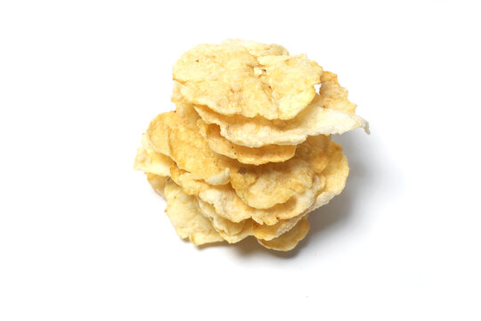 a stack of Emping, a traditional Indonesian snack made from melinjo nuts (Gnetum gnemon). These crackers have a distinct pale-yellow color with slightly browned edges from being fried