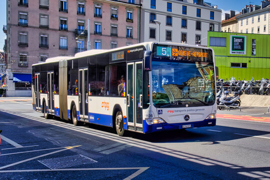 Ageneva, switzerland - 08 September 2022: comfortable TPG bus navigates a lively street in Geneva Switzerland on September eighth showcasing local transportation.