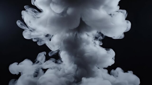 Billowing white smoke cloud erupts against a dark, contrasting background