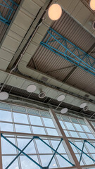 Obraz premium Modern Industrial Ceiling With Glass Windows And Geometric Structure, Architecture Background With Copy Space For Business And Design