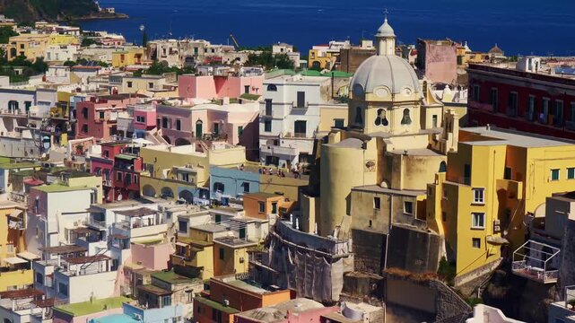 Aerial view of Santa Maria delle Grazie church and colorful houses in Procida, Italy