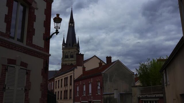 Church and street view in Epernay France with cloudy sky