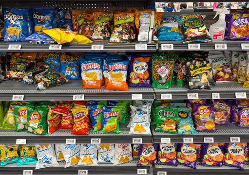 Snack Chips And Potato Chips Shelf Display In Grocery Store Aisle