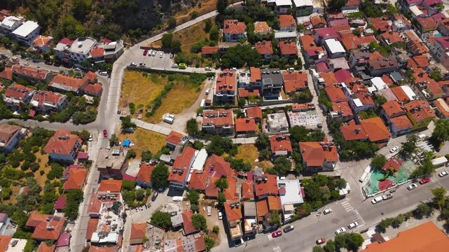 Fethiye, Turkey. Historic site of Telmessos featuring the monumental Tomb of Amyntas and ancient Lycian rock tombs carved into cliffs, aerial drone view.. Aerial View, MasterShots, Fly Forward - Roll