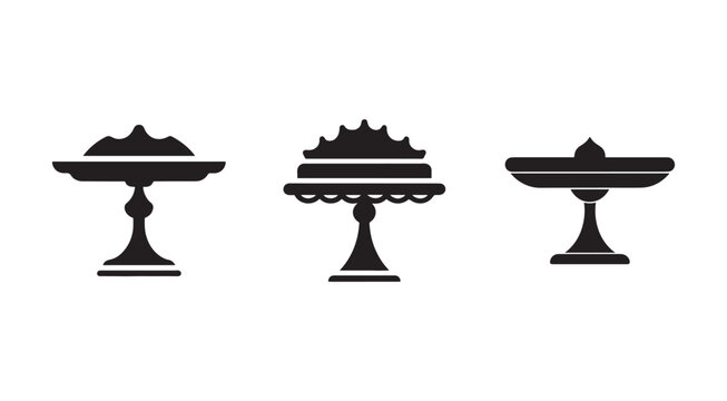 Three black silhouettes of decorative cake stands with cakes on top  isolated on white background