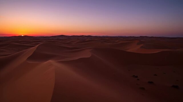 Spectacular Sunset over Endless Sand Dunes in a Desert Landscape