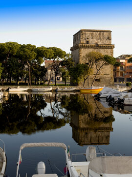 Matilde Tower in Viareggio with reflection water boats Tuscany
