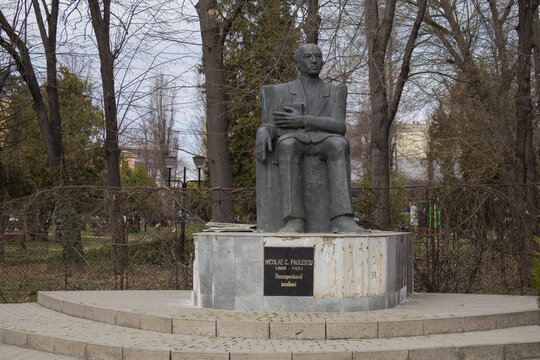 Bronze statue of Nicolae C. Paulescu, the discoverer of insulin, in a park setting in Bucuresti, Romania - March 14 2026