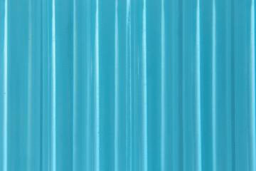 Obraz premium Abstract ribbed smooth blue striped plastic pattern or texture as background