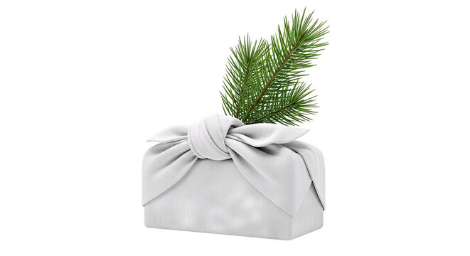 Gift wrapped in white fabric with pine sprig
