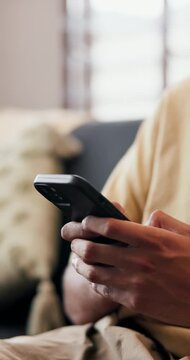 Hands, phone and typing in home for social media comment, response or contact for online dating. Mobile, person and text in living room for relax, connection or message for matchmaking on internet