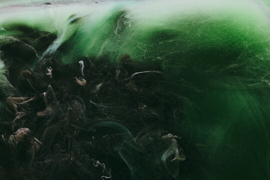 Abstract green background. Moving smoke flow, fluid liquid art.