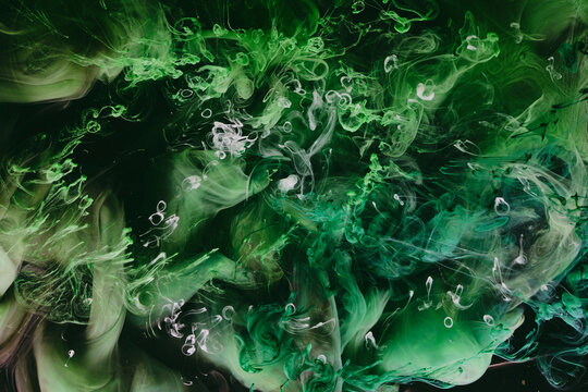 Abstract green background. Moving smoke flow, fluid liquid art.
