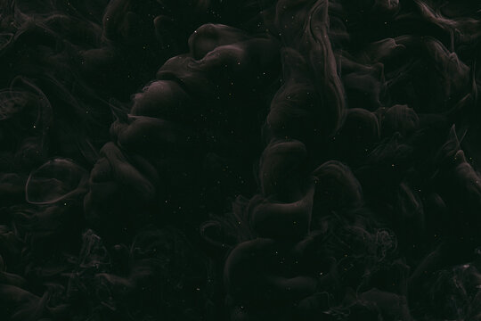 Abstract dark matter, black background. Moving flow of smoke and paints