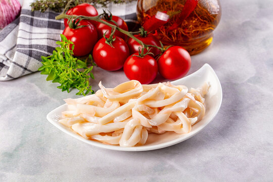 Canned marinated squid rings heap