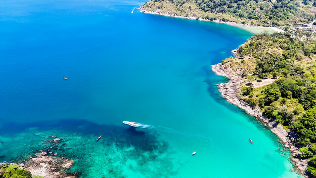 Stunning aerial view of the beach. An aerial photograph of the beautiful tropical beach and sea on Phuket Island. Located at Freedom Beach, Phuket, Thailand, at 10 am &ndash; the start of sunbathing, summer