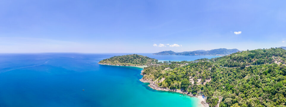 Stunning aerial view of the beach. An aerial photograph of the beautiful tropical beach and sea on Phuket Island. Located at Freedom Beach, Phuket, Thailand, at 10 am &ndash; the start of sunbathing, summer